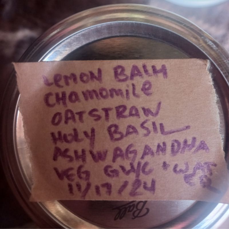 label of herbs + date on top of jar lid.